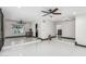 Spacious living room features bright white tile floors and open layout to an updated kitchen at 4020 W Anderson Dr, Glendale, AZ 85308