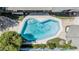 Aerial view of the backyard pool shows a unique shape, a lounge area and access to the home at 4020 W Anderson Dr, Glendale, AZ 85308