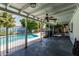 Covered patio overlooks the shimmering pool with decorative rock and mural for a peaceful outdoor retreat at 4020 W Anderson Dr, Glendale, AZ 85308