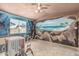 The room showcases unique ocean and cave-themed murals, enhancing the space's distinctive and personalized design at 4020 W Anderson Dr, Glendale, AZ 85308
