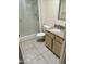 Cozy bathroom featuring granite countertop, white ceramic sink, and glass-enclosed shower at 17406 N 130Th Ave, Sun City West, AZ 85375