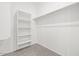Walk-in closet with built-in shelving at 5688 S 243Rd Dr, Buckeye, AZ 85326