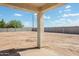 Large backyard with covered patio and desert landscaping at 4160 N Kioha Dr, Eloy, AZ 85131