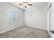 Bright bedroom with ceiling fan and neutral carpeting at 4160 N Kioha Dr, Eloy, AZ 85131