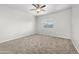 Spacious bedroom with neutral carpeting and a ceiling fan at 4160 N Kioha Dr, Eloy, AZ 85131