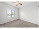 Well-lit bedroom featuring a ceiling fan and window blinds at 4160 N Kioha Dr, Eloy, AZ 85131