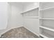 Spacious walk-in closet with shelving and hanging rod at 4160 N Kioha Dr, Eloy, AZ 85131