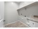 Laundry room with granite countertop and built-in shelving at 4160 N Kioha Dr, Eloy, AZ 85131