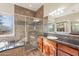 Primary bathroom with granite vanity, large shower and soaking tub at 1681 E Grand Ridge Rd, Queen Creek, AZ 85140