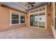 Covered patio with tile flooring, ceiling fan and sliding glass doors at 1681 E Grand Ridge Rd, Queen Creek, AZ 85140