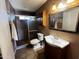 Bathroom with vanity, toilet, and shower at 12438 N 111Th Ave, Youngtown, AZ 85363