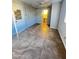 Bedroom with tile floor and access to bathroom at 12438 N 111Th Ave, Youngtown, AZ 85363