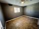 Bedroom with tile floor and ceiling fan at 12438 N 111Th Ave, Youngtown, AZ 85363