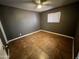 Bedroom with tile floor and ceiling fan at 12438 N 111Th Ave, Youngtown, AZ 85363