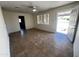 Living room with tile floor and access to exterior at 12438 N 111Th Ave, Youngtown, AZ 85363