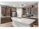 Spacious kitchen, featuring dark brown cabinets and granite countertops at 6375 W Sonoma Way, Florence, AZ 85132