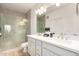 Bright bathroom boasts a spacious glass shower, double sinks, and modern lighting fixtures at 2511 W Queen Creek Rd # 179, Chandler, AZ 85248