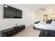 Modern bedroom featuring a large TV, sleek console, and plush bedding for ultimate comfort and style at 2511 W Queen Creek Rd # 179, Chandler, AZ 85248