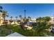 Beautiful community featuring lush landscaping, mature palm trees, and convenient parking at 2511 W Queen Creek Rd # 179, Chandler, AZ 85248