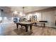 Community game room has a pool table, shuffleboard table, and fireplace at 2511 W Queen Creek Rd # 179, Chandler, AZ 85248
