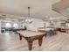 Community game room has a pool table, dining area, and kitchen at 2511 W Queen Creek Rd # 179, Chandler, AZ 85248