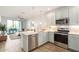 Bright kitchen features stainless steel appliances, pendant lighting, and a convenient breakfast bar at 2511 W Queen Creek Rd # 179, Chandler, AZ 85248