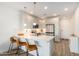 Bright kitchen offers an island with seating, stainless appliances, and ample countertop space at 2511 W Queen Creek Rd # 179, Chandler, AZ 85248