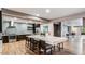Community kitchen with a spacious island, stainless steel appliances, and stylish tile backsplash, perfect for gatherings at 2511 W Queen Creek Rd # 179, Chandler, AZ 85248