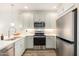 Modern kitchen boasts stainless steel appliances, ample cabinet space, and sleek countertops at 2511 W Queen Creek Rd # 179, Chandler, AZ 85248