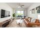Spacious living room opens to a balcony, offering comfortable seating and natural light at 2511 W Queen Creek Rd # 179, Chandler, AZ 85248