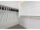 Spacious walk-in closet offering ample storage with hanging racks and shelving for organized living at 2511 W Queen Creek Rd # 179, Chandler, AZ 85248