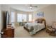 Cozy bedroom featuring a large window, dresser and rocking chair at 5074 N Scottsdale Rd, Eloy, AZ 85131