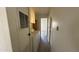 Functional laundry area with a washing machine, dryer, and hallway access at 8730 E Dolega Ave, Mesa, AZ 85208