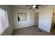 Bedroom featuring neutral walls, vinyl floor, window and a view of the bathroom at 8730 E Dolega Ave, Mesa, AZ 85208