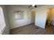 Bedroom featuring neutral walls, vinyl floor, window and a view of the ensuite bathroom at 8730 E Dolega Ave, Mesa, AZ 85208