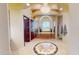 Elegant bathroom with a chandelier, soaking tub with pillars and travertine tile work at 9233 S Krista E Dr, Goodyear, AZ 85338