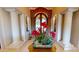 Close up on Foyer with decorative columns and an ornate front door for a luxurious entrance at 9233 S Krista E Dr, Goodyear, AZ 85338