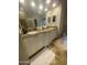 The primary bathroom features granite counters, double sinks, and tiled floors at 17408 N 57Th St, Scottsdale, AZ 85254