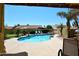 Backyard oasis featuring a private pool, lush landscaping, and a rock waterfall at 17408 N 57Th St, Scottsdale, AZ 85254