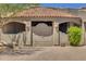 Ornate wooden gate leading to a courtyard at 1710 E Staghorn Ln, Carefree, AZ 85377