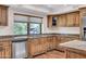 Kitchen with granite countertops, stainless steel dishwasher, and wood cabinets at 1710 E Staghorn Ln, Carefree, AZ 85377