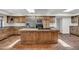 Spacious kitchen with island, stainless steel appliances, and wood cabinets at 1710 E Staghorn Ln, Carefree, AZ 85377