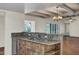 Kitchen with breakfast bar, granite countertops, and wood cabinets at 1710 E Staghorn Ln, Carefree, AZ 85377