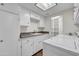 Laundry room with white cabinets, countertop, and washer/dryer at 1710 E Staghorn Ln, Carefree, AZ 85377