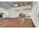 Living room with fireplace, wood beams, and tile floors at 1710 E Staghorn Ln, Carefree, AZ 85377