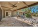 Peaceful patio featuring lounge chairs and a large shade tree at 1710 E Staghorn Ln, Carefree, AZ 85377