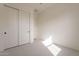 Simple bedroom with double door closet and carpet flooring at 17990 W Long Lake Rd, Goodyear, AZ 85338