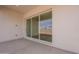 Modern patio with sliding glass doors leading to the backyard at 17990 W Long Lake Rd, Goodyear, AZ 85338