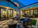 Inviting backyard featuring a cozy seating area, outdoor kitchen, and seamless indoor-outdoor living at 3955 E Sierra Vista Dr, Paradise Valley, AZ 85253