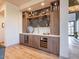 Stylish bar area featuring custom cabinetry, a sink, and a built-in wine cooler at 3955 E Sierra Vista Dr, Paradise Valley, AZ 85253